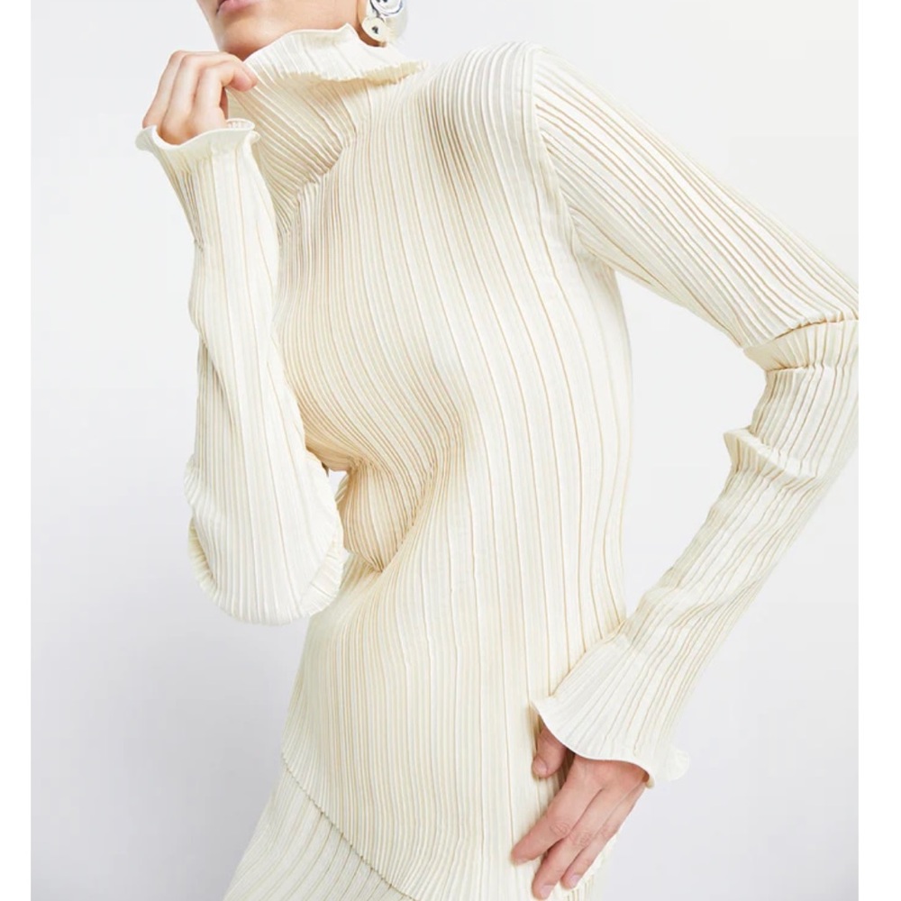 WORN ONCE Simonett cream-colored plisse “Mirez” top